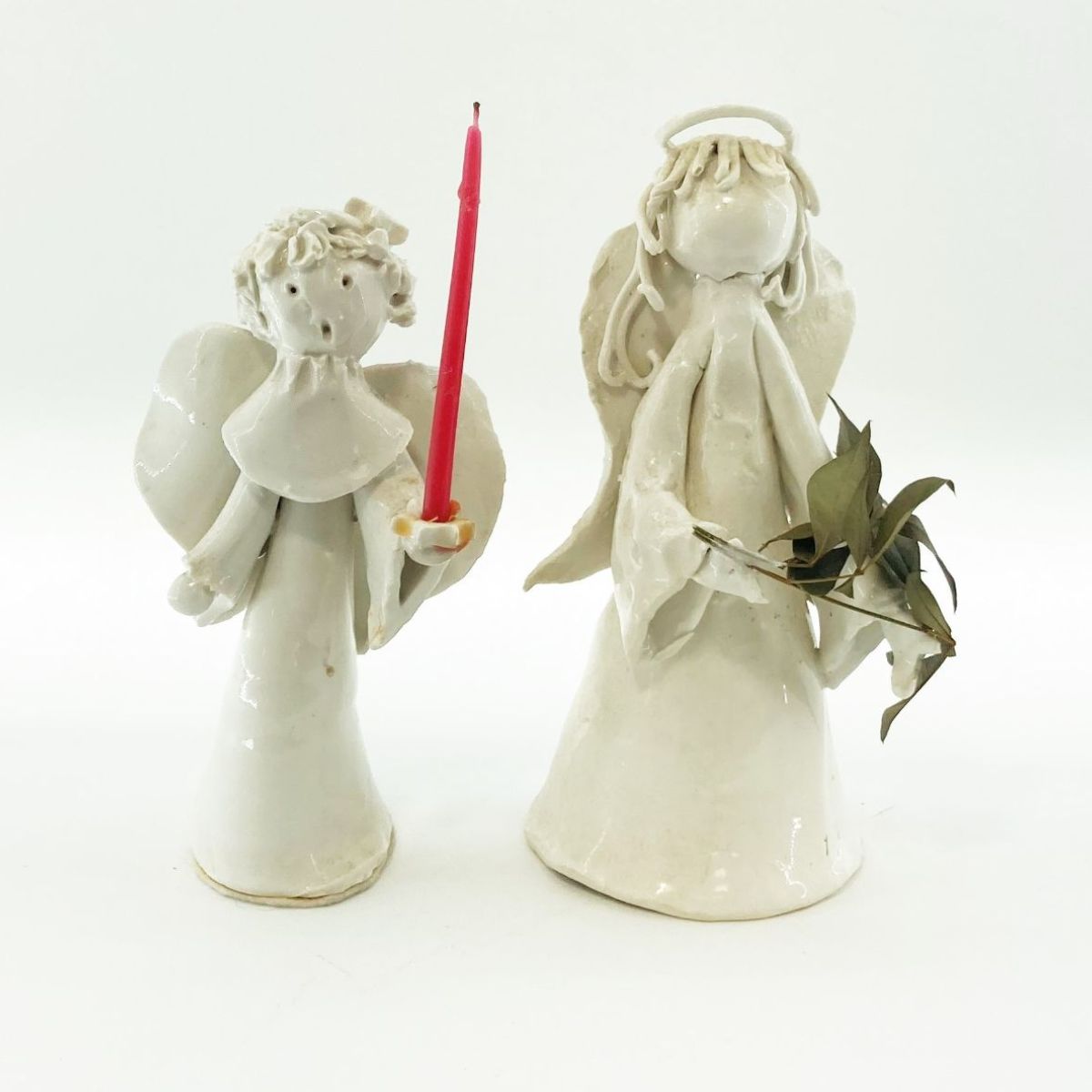 two hand made ceramic angels in white